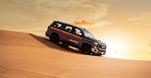 Dubai: Dune Rosse con giro in cammello, sandboarding e opzioni di barbecue